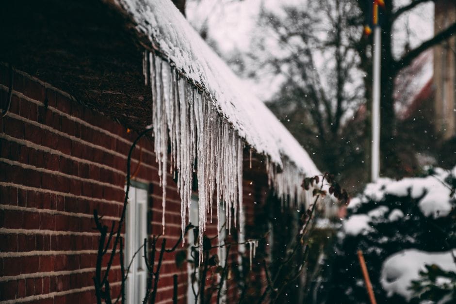 ice dam on roof eaves winter weather